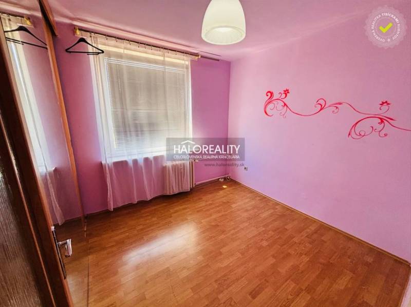 A children's room with purple walls and wall decorations in a 3-room apartment.