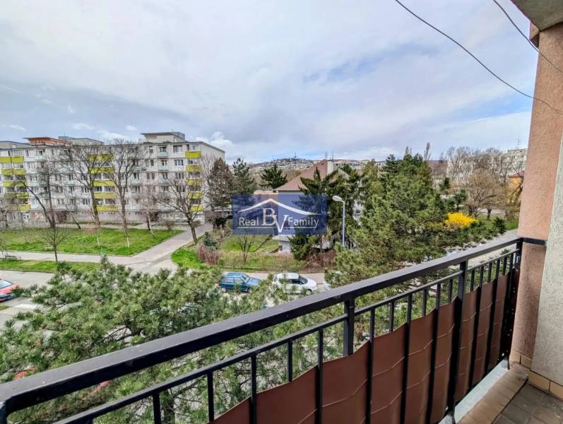 View from the balcony of greenery and apartment buildings on Sibírska Street in Bratislava - Nové Mesto.