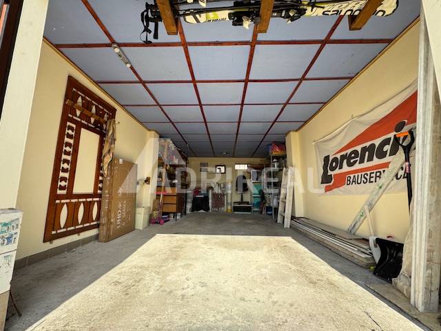 Garages used for storage and maintenance with various equipment and tools.