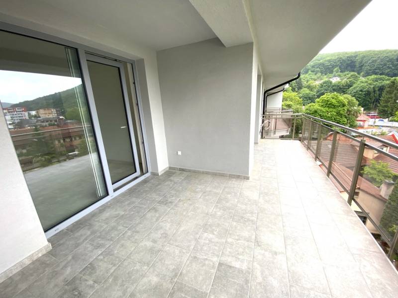 Spacious balcony with a view of the surrounding landscape in a 2-room apartment in Rajecké Teplice.