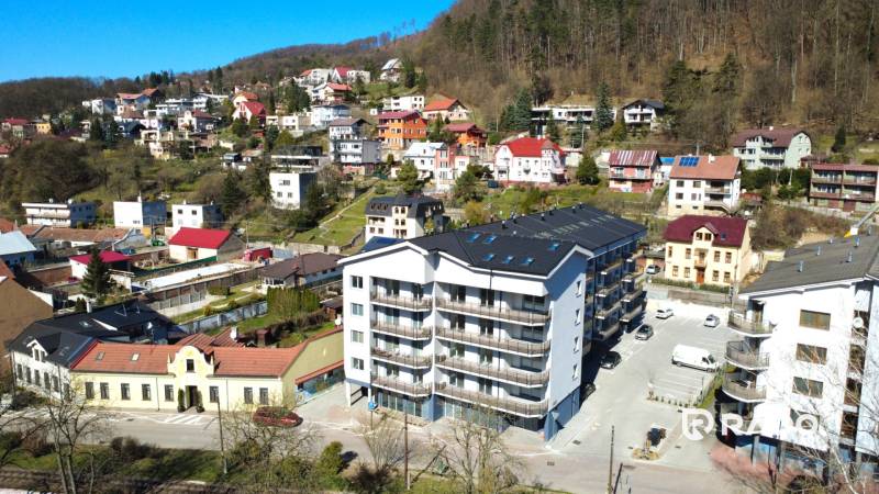 The image captures the surrounding houses and a new apartment complex on Nádražná Street.