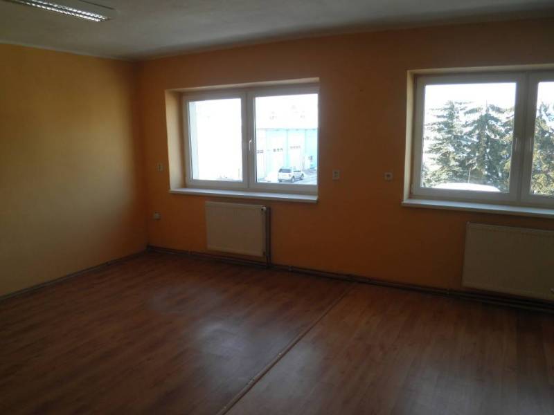 Empty room with wooden floor and windows in offices.