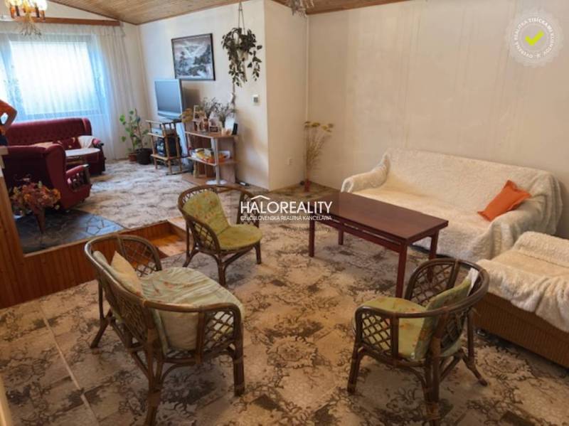 Interior of a family house with a cozy living space, carpets, and comfortable furniture.
