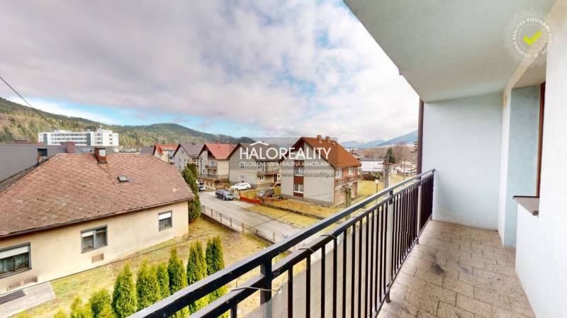 From the balcony, you can see picturesque houses and nature, ideal for a studio apartment.