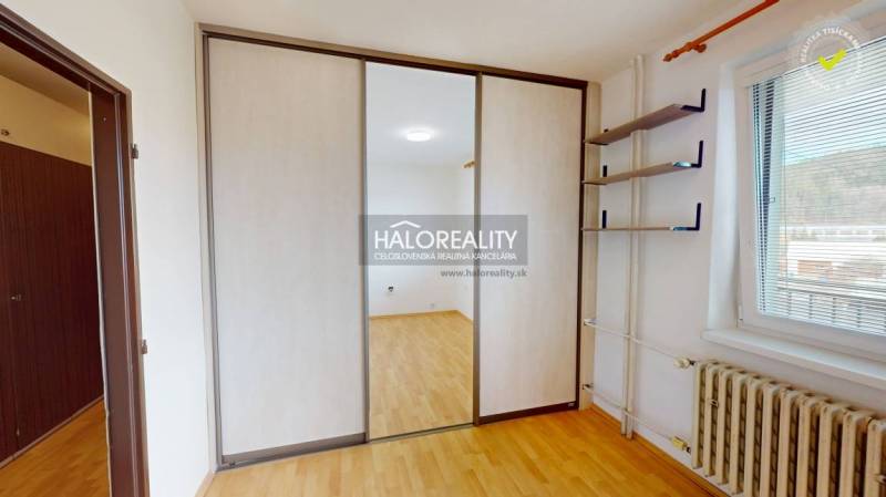An apartment with sliding doors, storage space, and plenty of natural light.