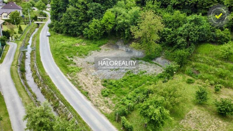 A residential plot in Selce with a road and greenery in a picturesque setting.