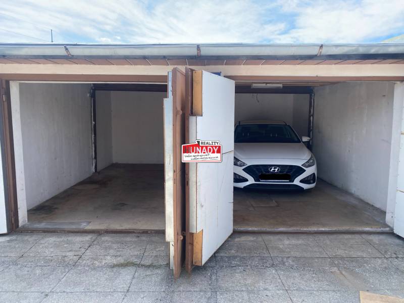 Two garages on Kolárska Street in Spišská Nová Ves, one empty.