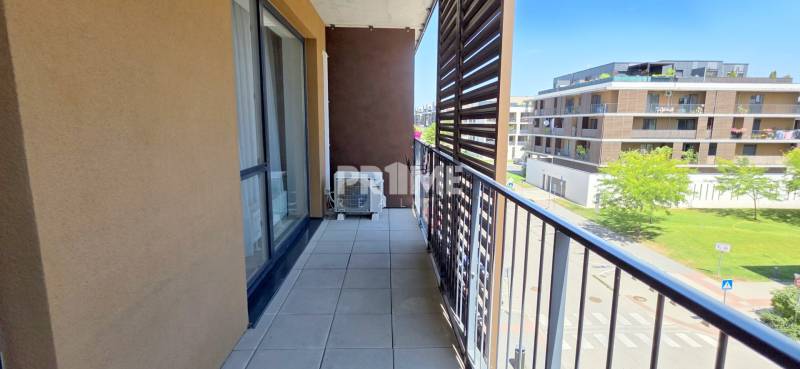 The balcony of a 2-room apartment on Žltá Street in Bratislava - Petržalka with a view of the surroundings.