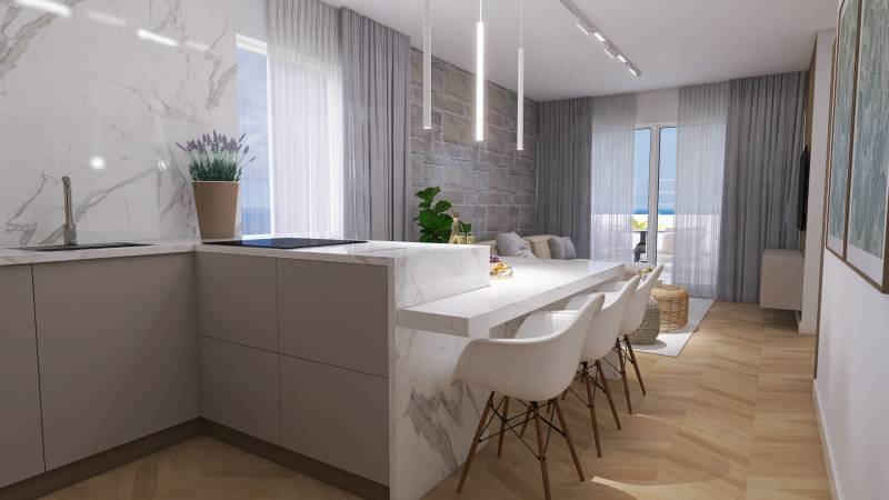 A bright kitchen in a 4-room apartment with a marble counter and a dining table.