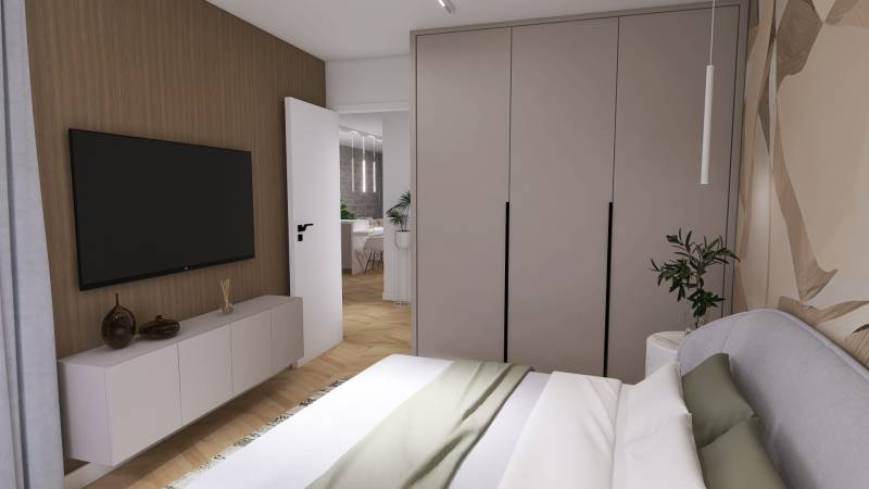Bedroom with a television, wardrobe, and decorations in a 4-room apartment.