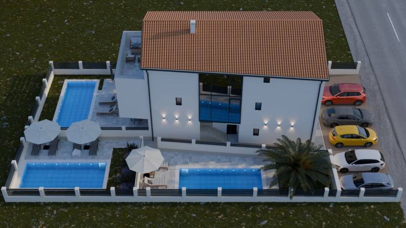 Exterior of a 4-room apartment in Mandre with a garden, pools, and parking spaces.