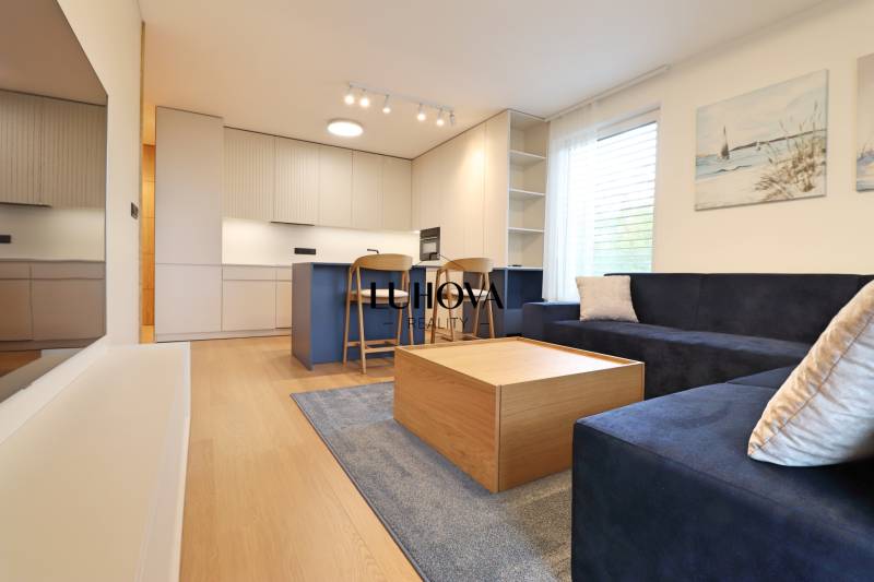 Living room with kitchen in a two-room apartment, bright interior with furniture.