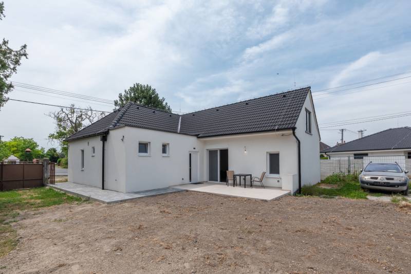 A family house on Stará Gala in Holice with a terrace and a yard without a lawn.
