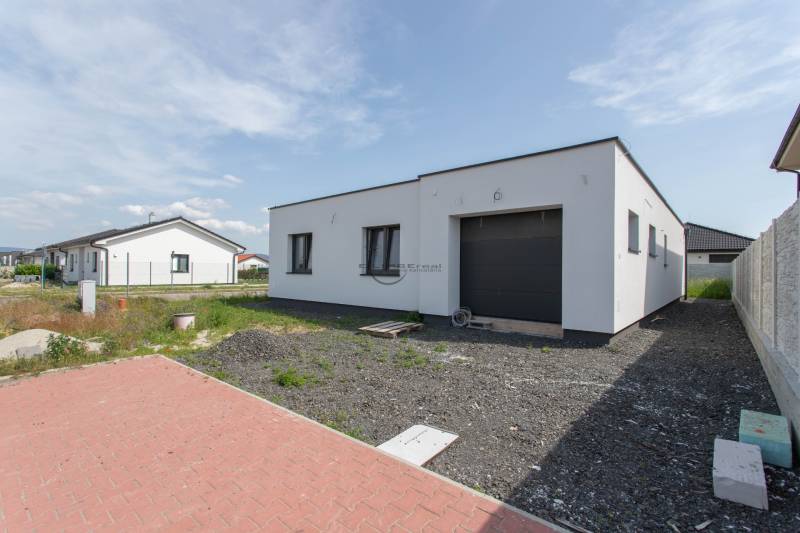 A family house in Zohor with a spacious parking area and a large garage.