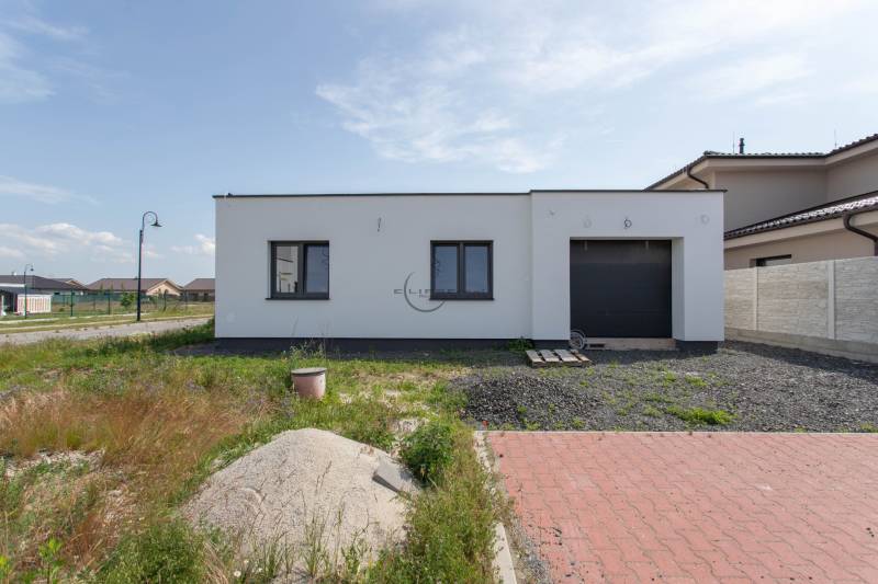 A family house in Zohor with a garden, garage, and driveway in a quiet suburb.