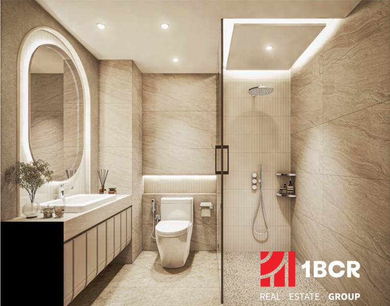 Bathroom with shower and toilet as part of apartment construction with decorations and lighting.