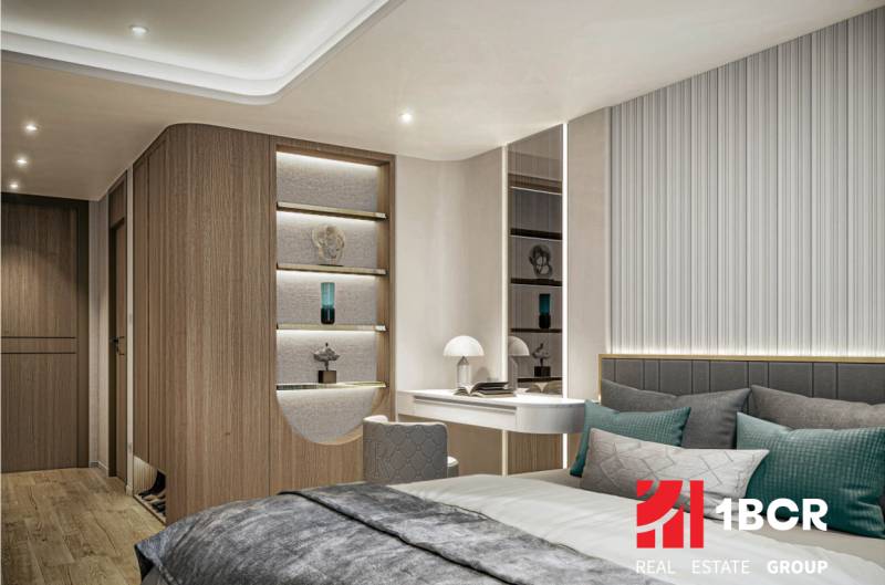 An interior with elegantly lit wood and a comfortable bed in an apartment construction.