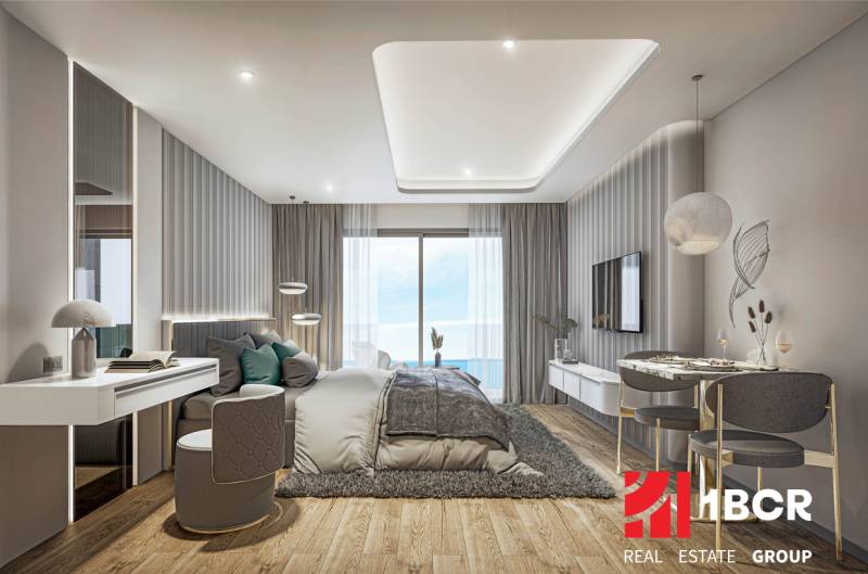 Luxury bedroom with ocean view within the apartment development.