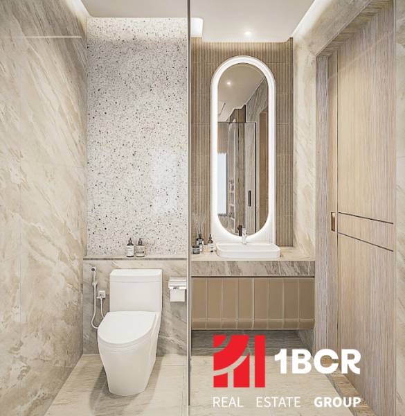 Bathroom in a 3-room apartment with modern sanitary equipment and illuminated mirror.