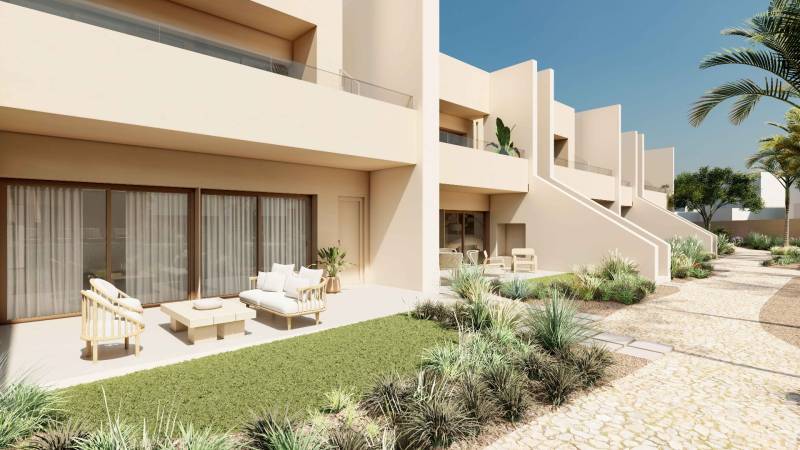 Terrace of a 4-room apartment in Rode with garden furniture and a well-maintained exterior.