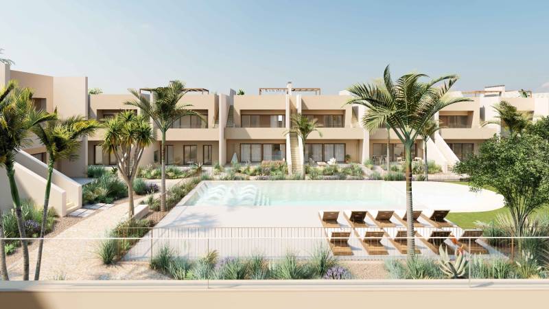 Apartment complex with a pool and palm trees in Rhodes, an ideal place for relaxation.