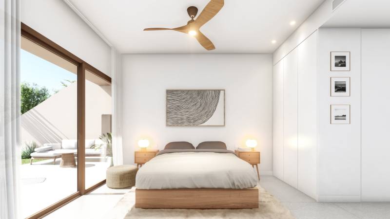 A bedroom with a bed, sliding doors, and minimalist decor in a 4-room apartment.