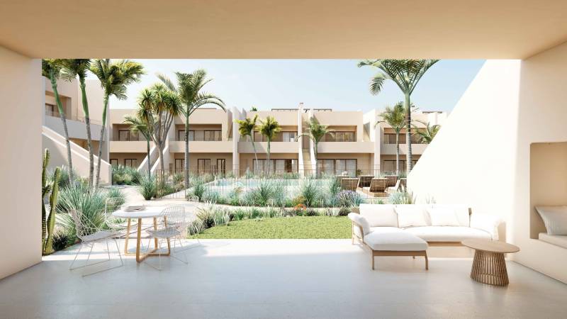 Terrace of a luxurious 4-room apartment in Roda with a view of the pool and greenery.