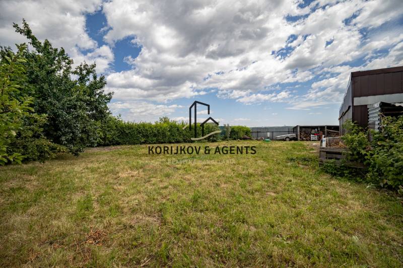 A grassy plot surrounded by trees on Svetlá Street, Košice - Barca district. Land - residential.