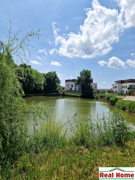 A view of the lake with suburban development on Vtáčia Street in Senec.