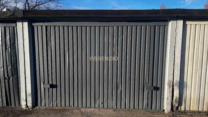 Closed metal garages on Prístavná Street, Bratislava - Ružinov, with peeling paint and the inscription 
