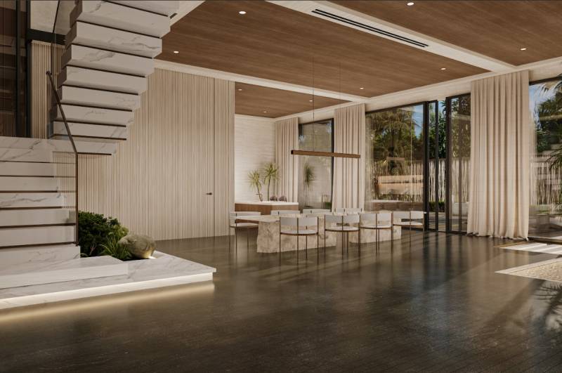 The interior of a family house with a connection to the outdoor space through large glass doors.