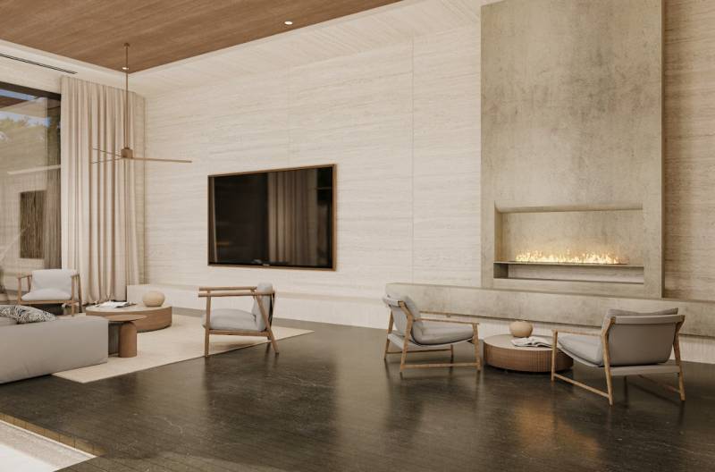 Luxurious interior of a family house with a fireplace and comfortable seating.