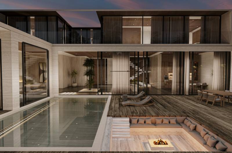 Interior of a family house with a pool, terrace, and a relaxing seating area by the fire.