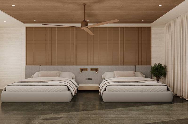 Interior of a family house with two beds, a ceiling fan, and a decorative panel.