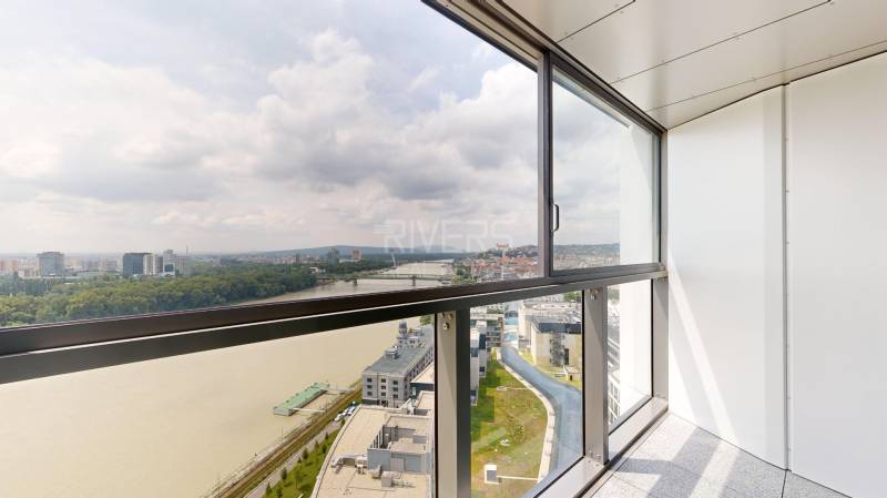 View of the river and the panorama of Bratislava from the balcony of a 4-room apartment.