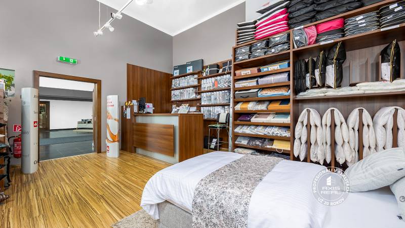 Store with bedding products, commercial space with shelves and a counter, cozy interior.