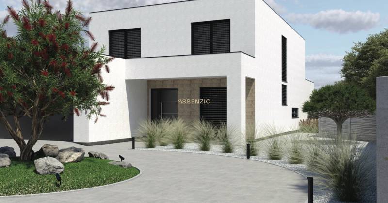 A family house in Opoj with a minimalist garden and a landscaped entrance.