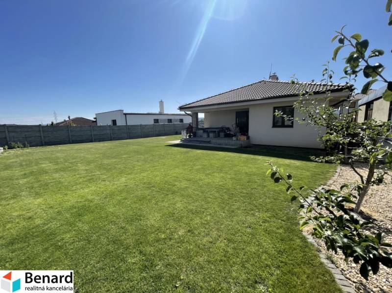 A family house in Prešov with a landscaped garden, lawn, and terrace.