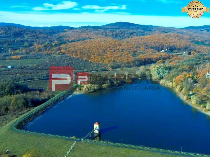 A lake surrounded by an autumn landscape in the Pezinok area, suitable for residential plots.