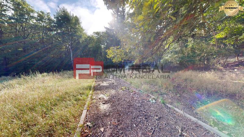 Sunny plot in Pezinok surrounded by forests, ideal for use as residential land.