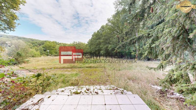 Nature in Pezinok, residential plots surrounded by forest and greenery.