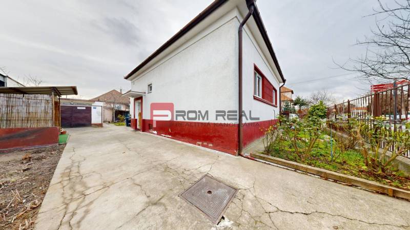 Family house on Farebná Street in Bratislava II with a concrete walkway and fencing.