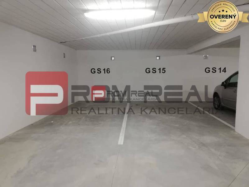 A picture from the parking lot on Slavomírova Street, offering a spot by a 2-room apartment.