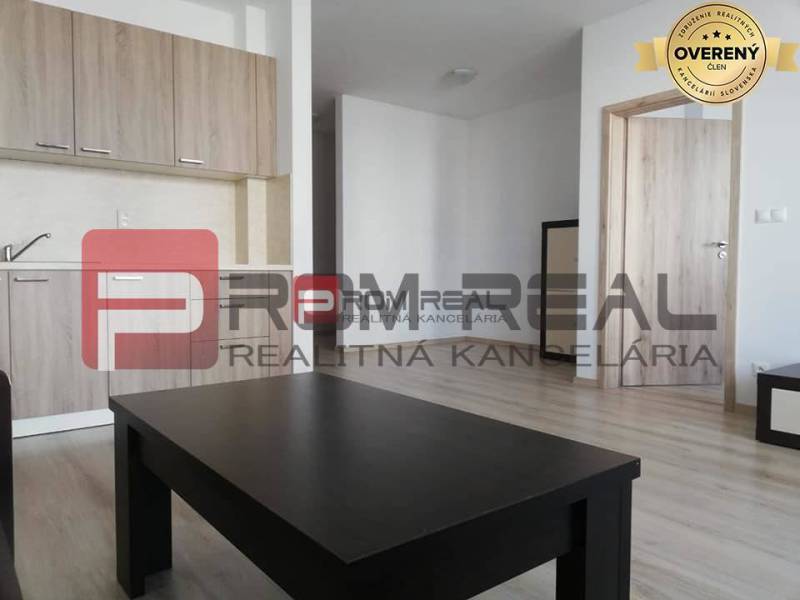 The interior of a 2-room apartment on Slavomírova Street with a kitchen and light furniture.