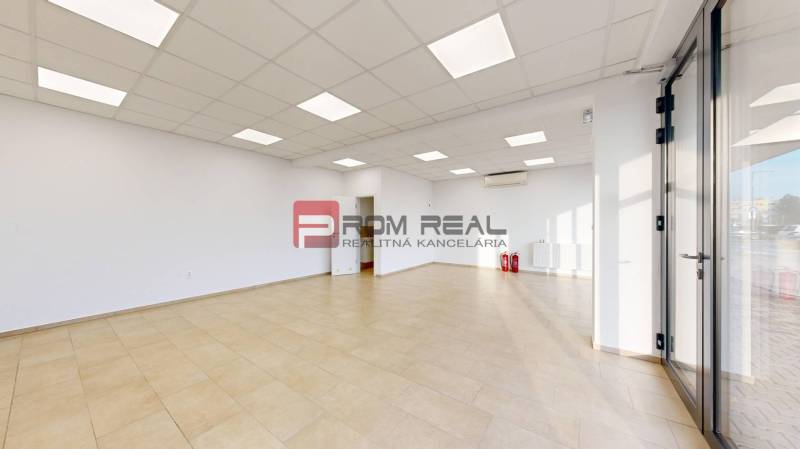 Brightly lit commercial spaces with tiled floors and glass doors.