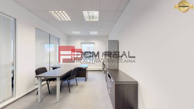 Offices with a desk, chairs, and shelves, suitable for a work environment.