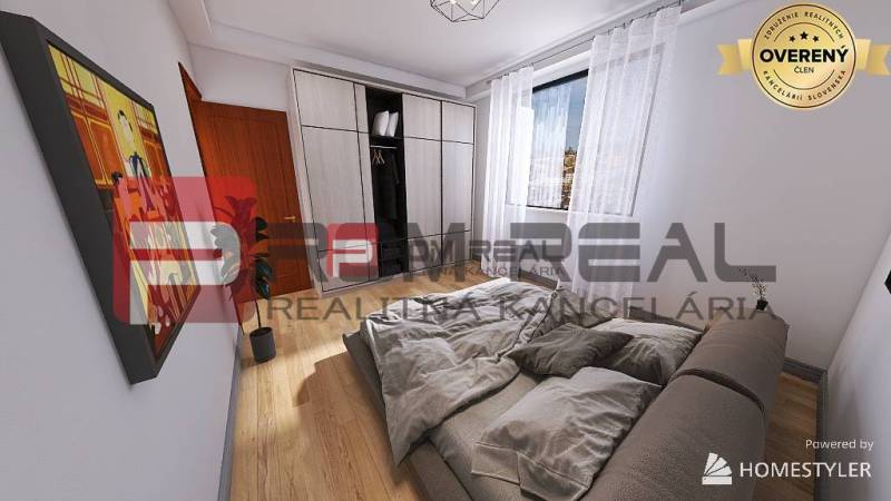 Bedroom in a 2-room apartment with a bed, built-in wardrobe, and a picture on the wall.