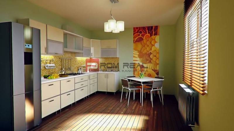 A kitchen in a 3-room apartment with a modern kitchen unit, dining table, and decorative wall.