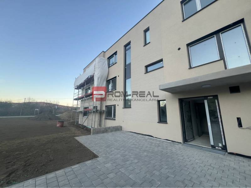 New apartment building in Pezinok on Pezinská Street with insulation work.