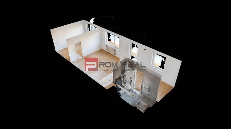 Interior of a 2-room apartment with flooring and white walls.